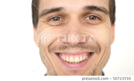 Face of young attractive successful smiling man on a white background Face of young attractive successful smiling man on a white background 50723550