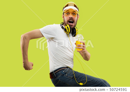 Half-length close up portrait of young man on yellow background Half-length close up portrait of young man on yellow background 50724591