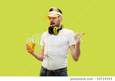 Half-length close up portrait of young man on yellow background Half-length close up portrait of young man on yellow background 50724593