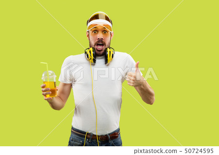 Half-length close up portrait of young man on yellow background Half-length close up portrait of young man on yellow background 50724595