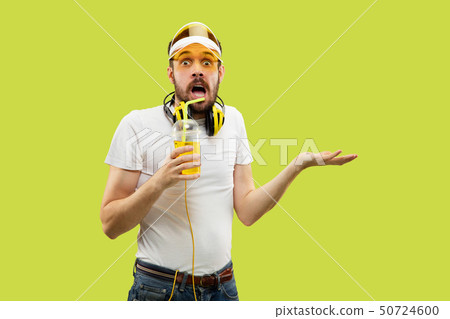 Half-length close up portrait of young man on yellow background Half-length close up portrait of young man on yellow background 50724600