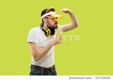 Half-length close up portrait of young man on yellow background Half-length close up portrait of young man on yellow background 50724604