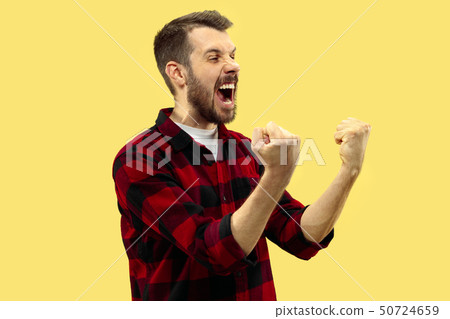 Half-length close up portrait of young man on yellow background. Half-length close up portrait of young man on yellow background. 50724659