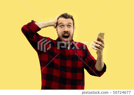 Half-length close up portrait of young man on yellow background. Half-length close up portrait of young man on yellow background. 50724677