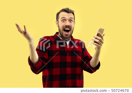 Half-length close up portrait of young man on yellow background. Half-length close up portrait of young man on yellow background. 50724678