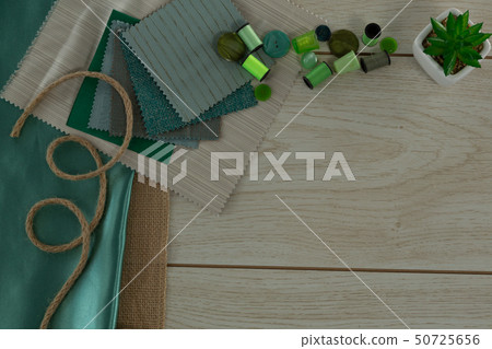 Textile and thread rolls on a table 50725656