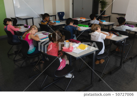 Kids studying in classroom 50727006