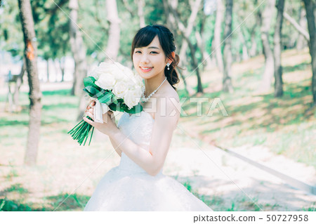 Women in a wedding dress Women in a wedding dress 50727958