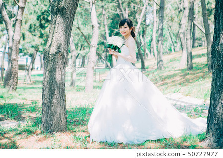 Women in a wedding dress Women in a wedding dress 50727977