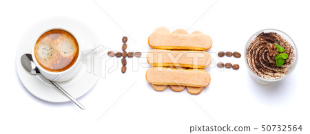 Cup of coffee plus savoiardi cookies equally Classic italian tiramisu dessert with blueberries in a Cup of coffee plus savoiardi cookies equally Classic italian tiramisu dessert with blueberries in a 50732564