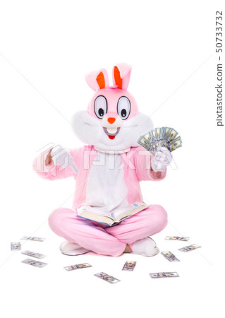 Knowledge is power. Rich lucky man reads the book, learning how to make money. Easter bunny rabbit 50733732