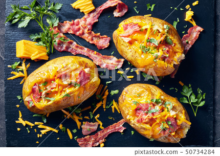 close-up of Loaded Potatoes on a plate close-up of Loaded Potatoes on a plate 50734284
