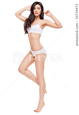 Fitness young woman with a beautiful body on white background 50734473