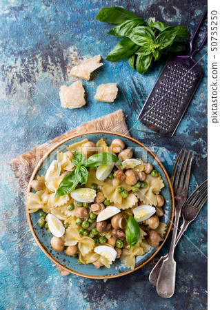 Farfalle pasta with mushrooms Farfalle pasta with mushrooms 50735250