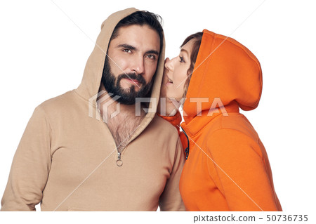 Woman whispering a secret to the man 50736735