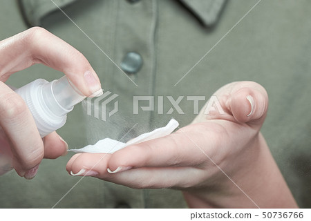 The girl clicks on the nail spray. Concept of Handcare Healthcare Nailcare. Beautiful Natural Nails 50736766