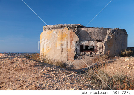 Abandoned concrete bunker WWII 50737272