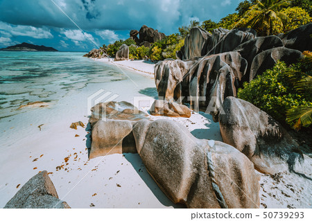 Anse Source d'Argent - Paradise beach with bizarre rocks, blue lagoon water on La Digue island in Anse Source d'Argent - Paradise beach with bizarre rocks, blue lagoon water on La Digue island in 50739293