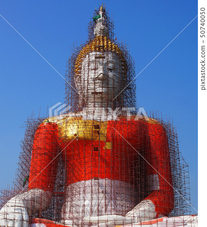 The Buddha statue is under repair in thai temple. The Buddha statue is under repair in thai temple. 50740050