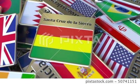 Souvenir magnet or badge with Santa Cruz de la Sierra text and national flag among different ones 50741151
