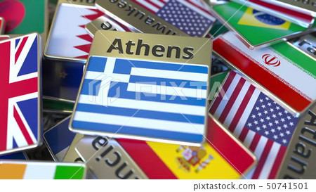 Souvenir magnet or badge with Athens text and national flag among different ones. Traveling to 50741501