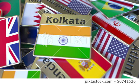 Souvenir magnet or badge with Kolkata text and national flag among different ones. Traveling to 50741526