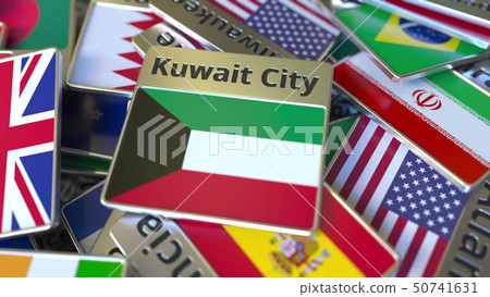 Souvenir magnet or badge with Kuwait City text and national flag among different ones. Traveling to 50741631