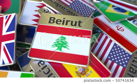 Souvenir magnet or badge with Beirut text and national flag among different ones. Traveling to 50741634