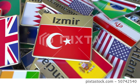 Souvenir magnet or badge with Izmir text and national flag among different ones. Traveling to Turkey Souvenir magnet or badge with Izmir text and national flag among different ones. Traveling to Turkey 50742540