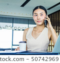 Businesswoman handling office management and lead  50742969