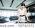 Business woman signing agreement.  Business contra 50742972