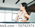 Businesswoman handling office management and lead  50742974