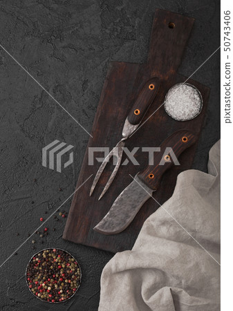 Vintage meat knife and fork on vintage chopping 50743406