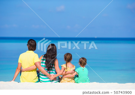 Happy beautiful family on white beach during summer vacation 50743900