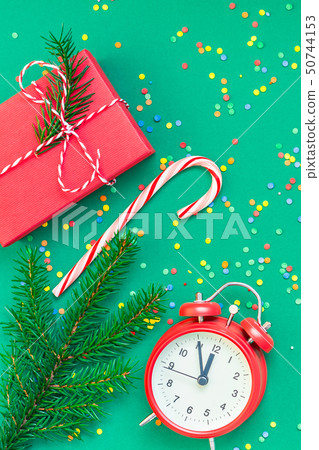 Christmas pattern flat lay with red alarm clock 50744153