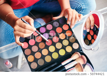 Mirror Close-Up Of Young Woman Applying Make-Up For Beauty Mirror Close-Up Of Young Woman Applying Make-Up For Beauty 50744421