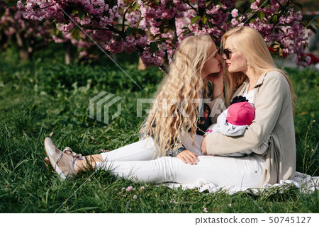 beautiful young mother walks with a small daughter 50745127