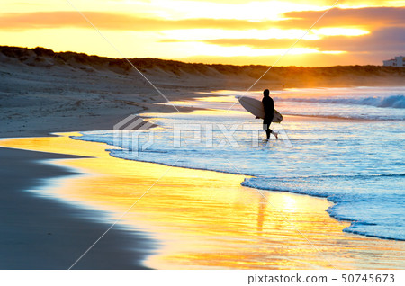 Silhouette surfer beach sunset Portugal 50745673