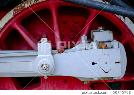 Vintage steam locomotive detail with cranks and red wheels Vintage steam locomotive detail with cranks and red wheels 50745708