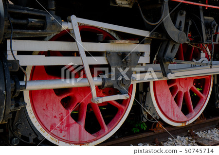 Vintage steam locomotive detail with cranks and red wheels Vintage steam locomotive detail with cranks and red wheels 50745714