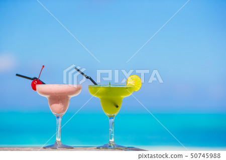 Two tasty cocktails on tropical white beach Two tasty cocktails on tropical white beach 50745988