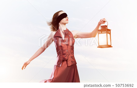 Attractive girl muse with old lantern in hand at summer day Attractive girl muse with old lantern in hand at summer day 50753692