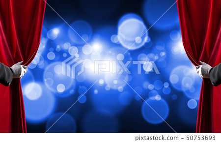 Bokeh lights behind drapery curtain and hand opening it Bokeh lights behind drapery curtain and hand opening it 50753693