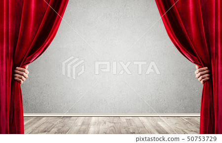 Concrete wall behind drapery curtain and hand opening it 50753729