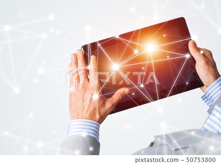 Hands of businessman holding tablet pc with blank screen and connection concept 50753800