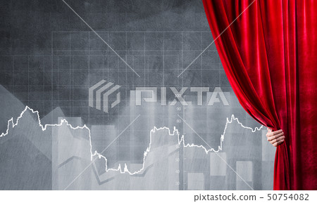 Graphs and diagrams behind drapery curtain and hand opening it Graphs and diagrams behind drapery curtain and hand opening it 50754082