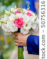 Flowering branch with white delicate flowers on wooden surface. Declaration of love, spring. Wedding 50756316