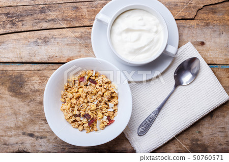 Healthy breakfast background. Muesli with yoghurt 50760571