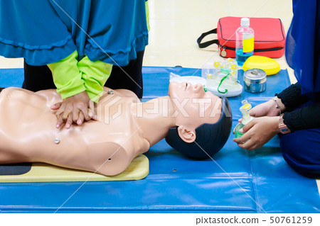 hand Heart pump with medical dummy on CPR hand Heart pump with medical dummy on CPR 50761259