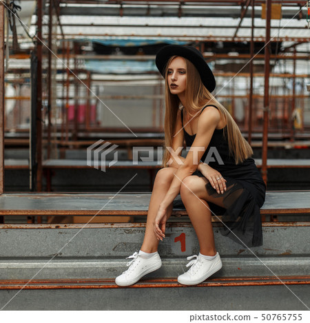 beautiful stylish woman with a fashionable hat beautiful stylish woman with a fashionable hat 50765755